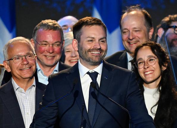 Parti Quebecois Leader Paul St-Pierre Plamondon (centre) speaks to supporters after winning the provincial election in Montreal, Quebec on Monday.